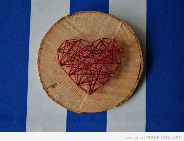 Heart String Art on a tree slice, step 1Heart String Art on a tree slice, step 3